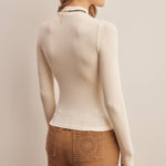 ivory ribbed mock neck top, fitted long sleeve top, stretchy ribbed layering top, women's mock neck shirt, long sleeve top with thumbholes, neutral fall layering top, soft fitted knit top, women's boutique basics