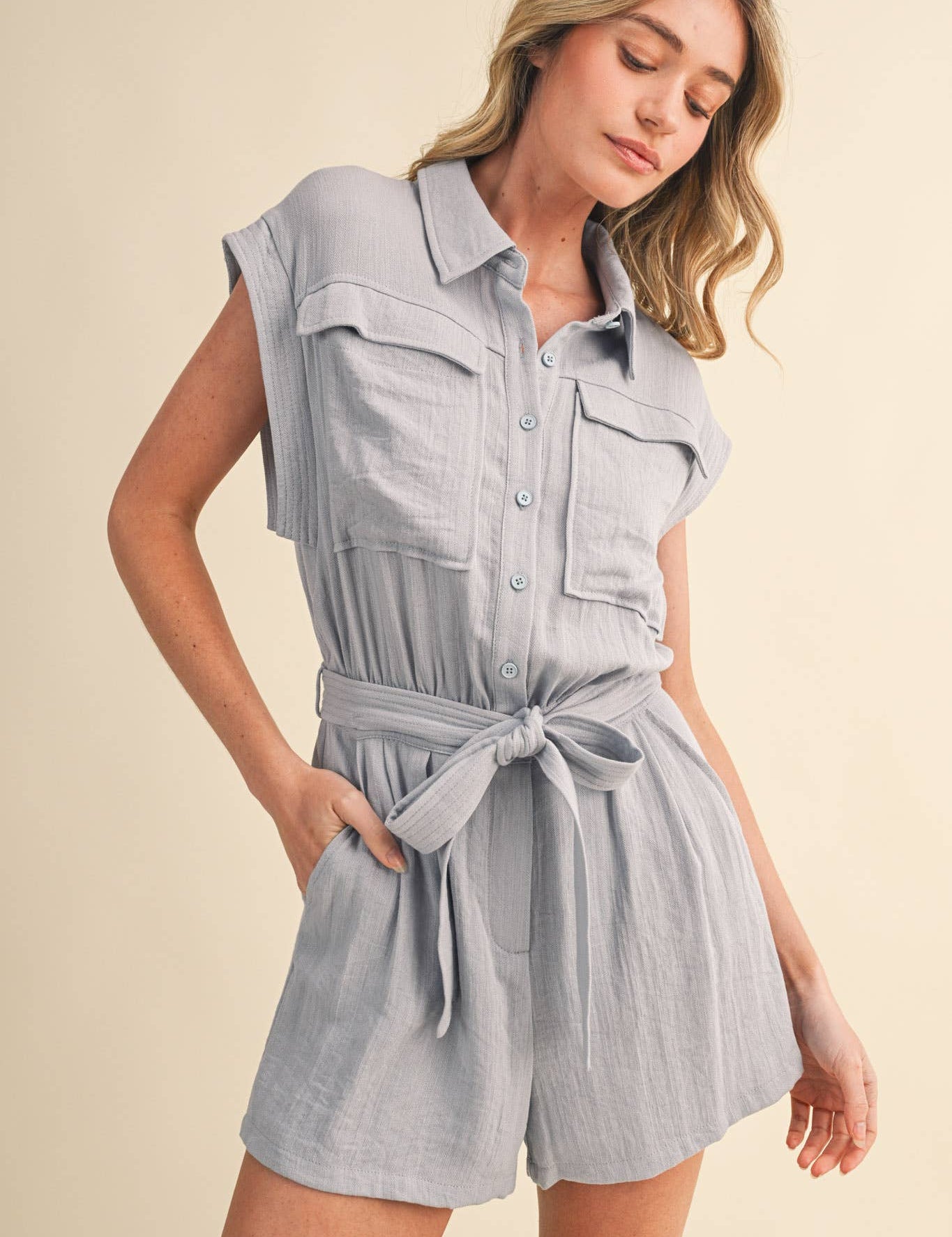 blue utility romper women
collared belted romper
cargo pocket summer romper
lightweight vacation romper
resort wear romper women
casual chic one piece outfit
travel outfit romper women
blue sleeveless romper boutique
elevated utility romper
west of may spritz collection