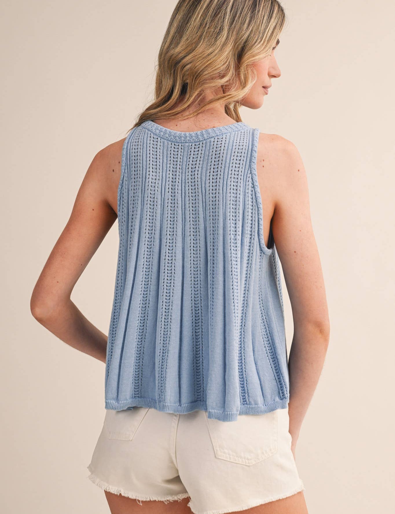 blue pointelle sweater tank
sleeveless knit tank women
lightweight sweater knit tank
round neck summer knit top
soft blue sleeveless sweater top
pointelle knit summer tank
women’s swing knit tank
coastal summer knit top
elevated casual summer top
summer spritz collection top