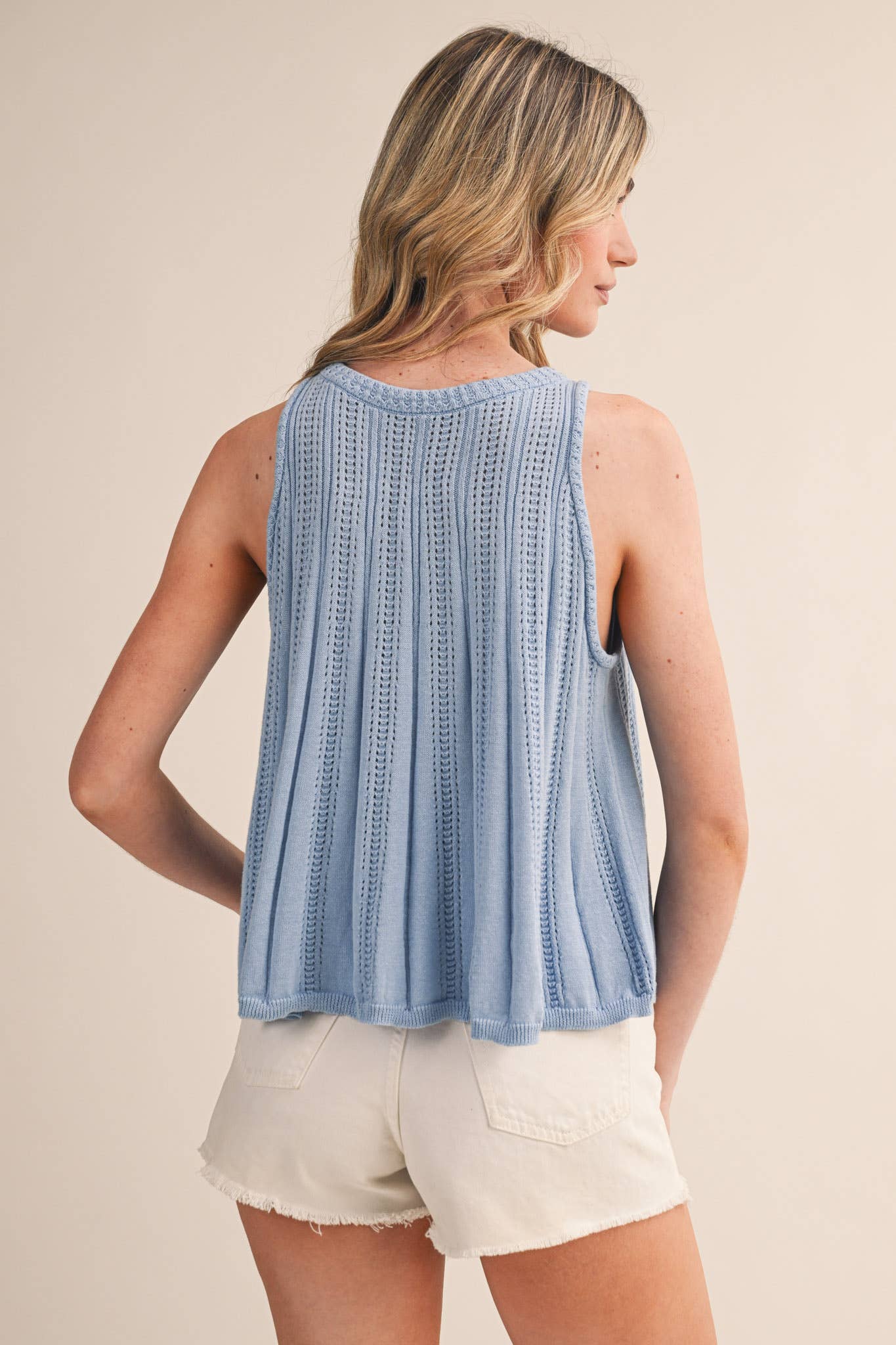 blue pointelle sweater tank
sleeveless knit tank women
lightweight sweater knit tank
round neck summer knit top
soft blue sleeveless sweater top
pointelle knit summer tank
women’s swing knit tank
coastal summer knit top
elevated casual summer top
summer spritz collection top
