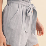 blue utility romper women
collared belted romper
cargo pocket summer romper
lightweight vacation romper
resort wear romper women
casual chic one piece outfit
travel outfit romper women
blue sleeveless romper boutique
elevated utility romper
west of may spritz collection