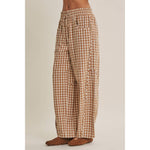 relaxed brown and cream gingham barrel pants in 100% cotton with an elastic drawstring waist, curved seaming and oversized pockets.