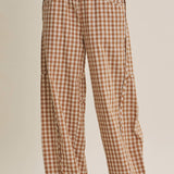 relaxed brown and cream gingham barrel pants in 100% cotton with an elastic drawstring waist, curved seaming and oversized pockets.