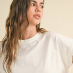 white boxy cotton t-shirt with relaxed fit
washed cotton crewneck tee with short sleeves
casual white cotton top styled with leopard pants
relaxed fit everyday cotton t-shirt
medium weight boxy cotton tee for women
classic white crewneck t-shirt with hip-length fit
minimalist cotton summer top
casual cotton tee for everyday wear