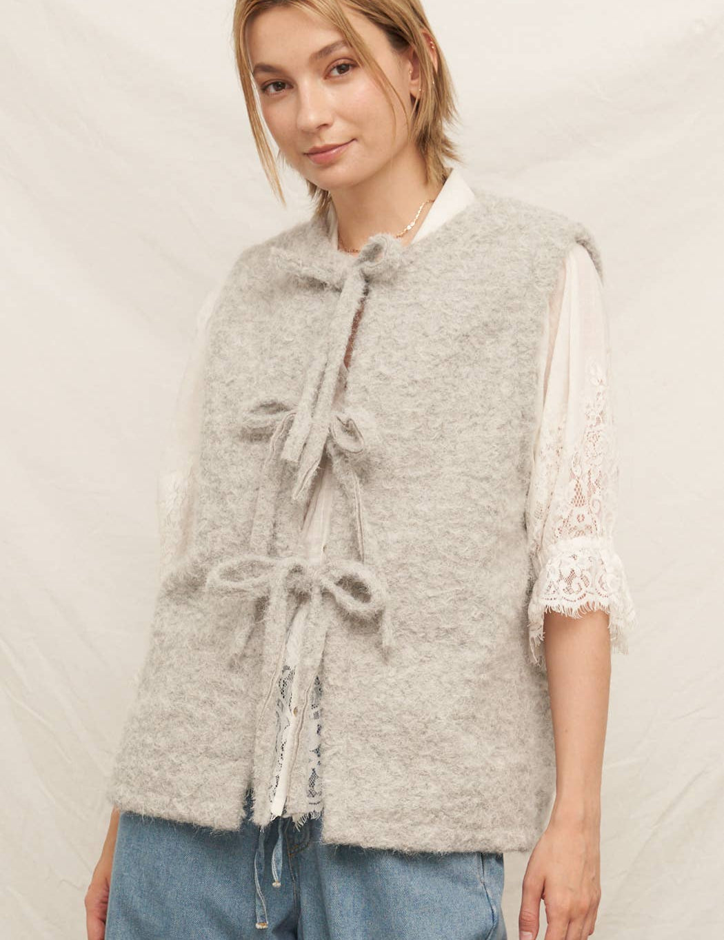 warm gray tie vest sweater