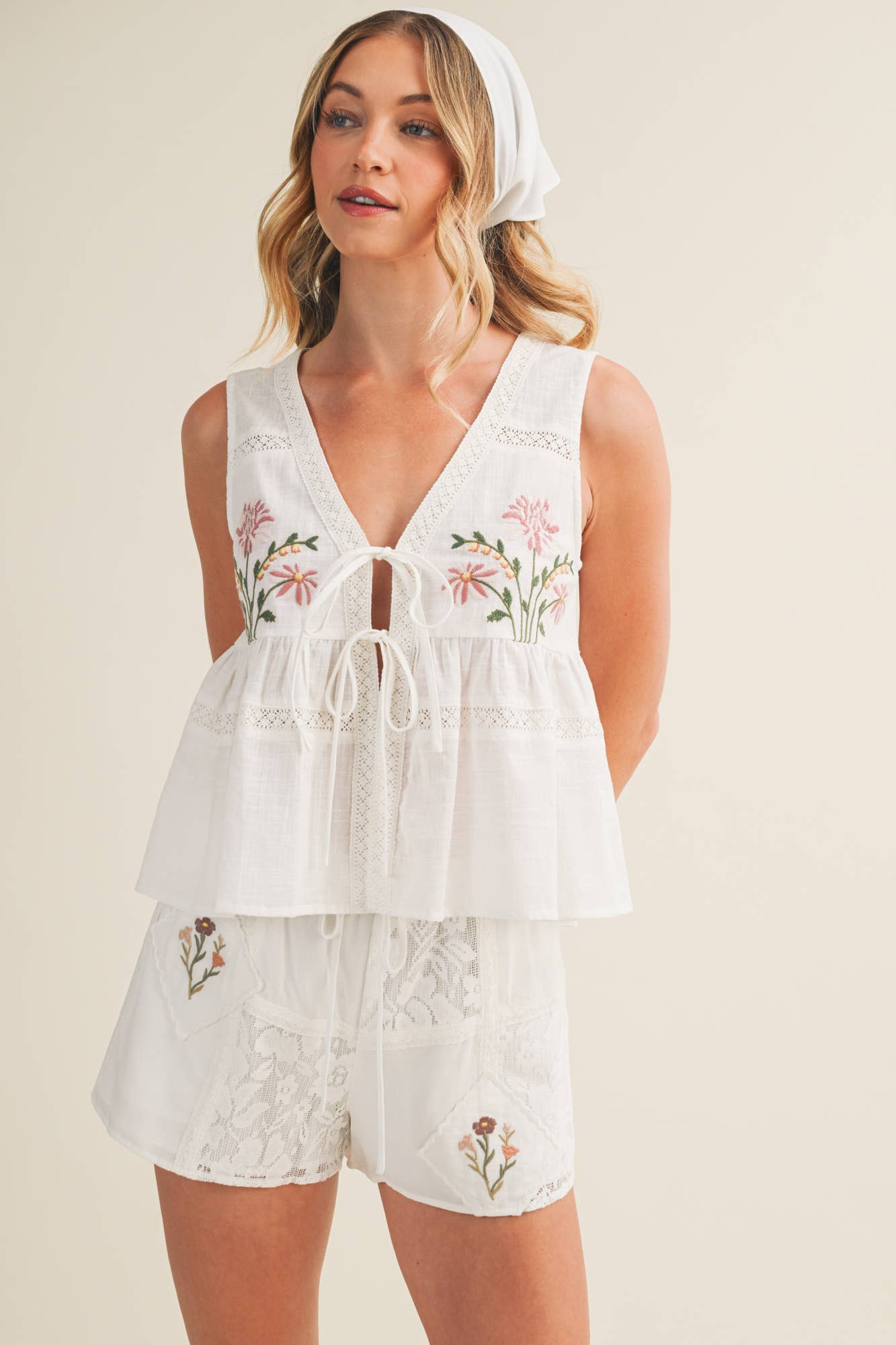 embroidered floral vest, tie front peplum top, white embroidered blouse, cottagecore vest top, lace trim sleeveless top, floral embroidered tank, boho peplum vest, embroidered cotton top, feminine tie front blouse, white summer vest