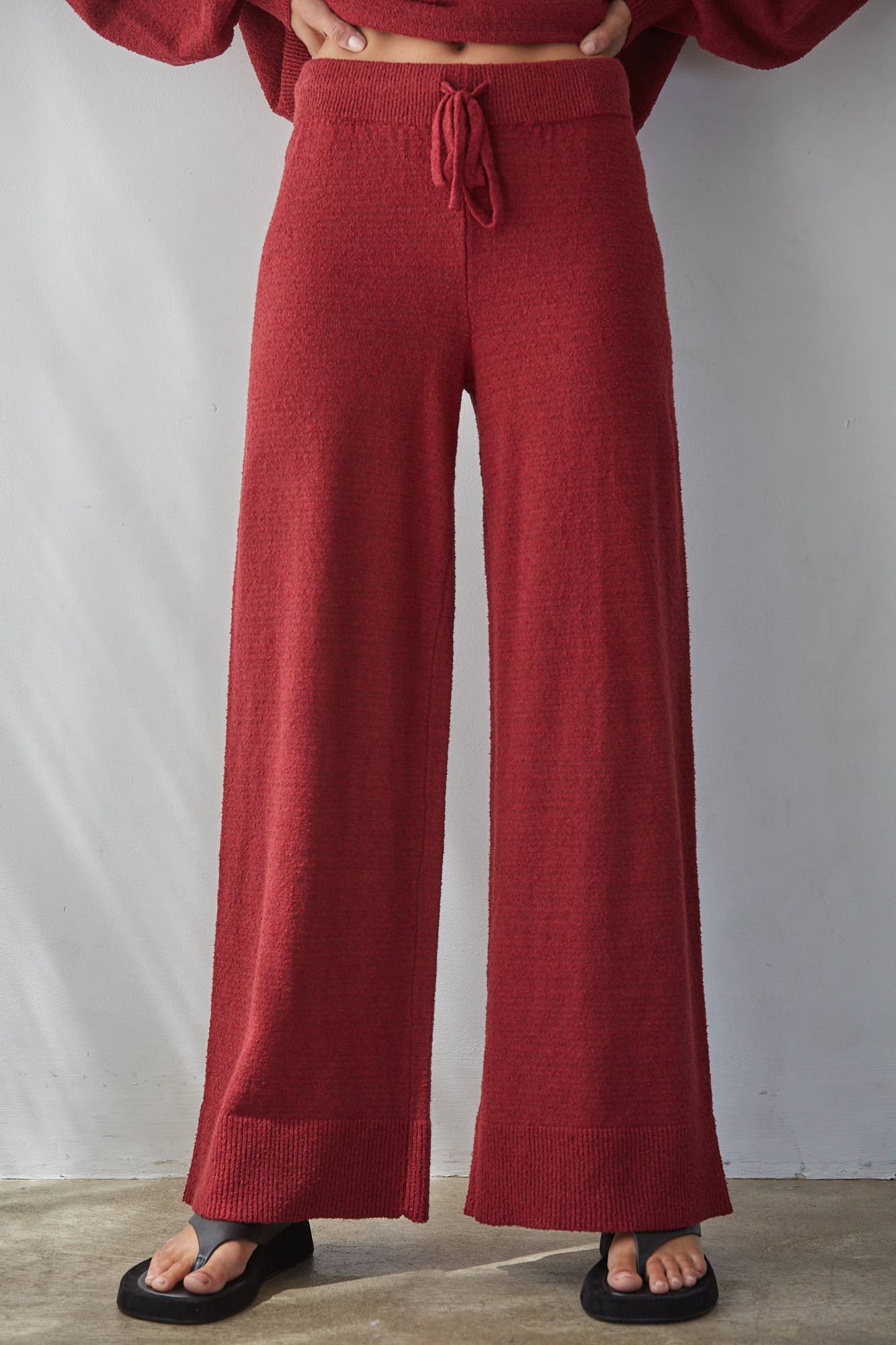 red knit pants, burgundy wide leg pants, women’s knit pants, matching knit set, red matching set women, wide leg lounge pants, fall pants women, holiday travel outfit, comfortable wide leg pants, boutique women’s pants