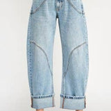 light wash high rise barrel jeans with curved statement seams and wide cuffed hems. available in sizes 1–15 and 1xl–3xl.