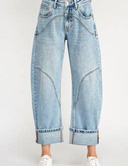 light wash high rise barrel jeans with curved statement seams and wide cuffed hems. available in sizes 1–15 and 1xl–3xl.