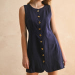 navy linen dress
button front linen dress
sleeveless mini dress
navy summer dress
linen shift dress
navy casual dress
linen dress with pockets
button front mini dress
fully lined linen dress
adjustable back tie dress
classic summer dress
navy sleeveless dress
boutique linen clothing
vacation dress women
timeless summer style
casual linen dress
women's linen mini dress
easy summer outfit
linen dress with buttons
americana summer fashion