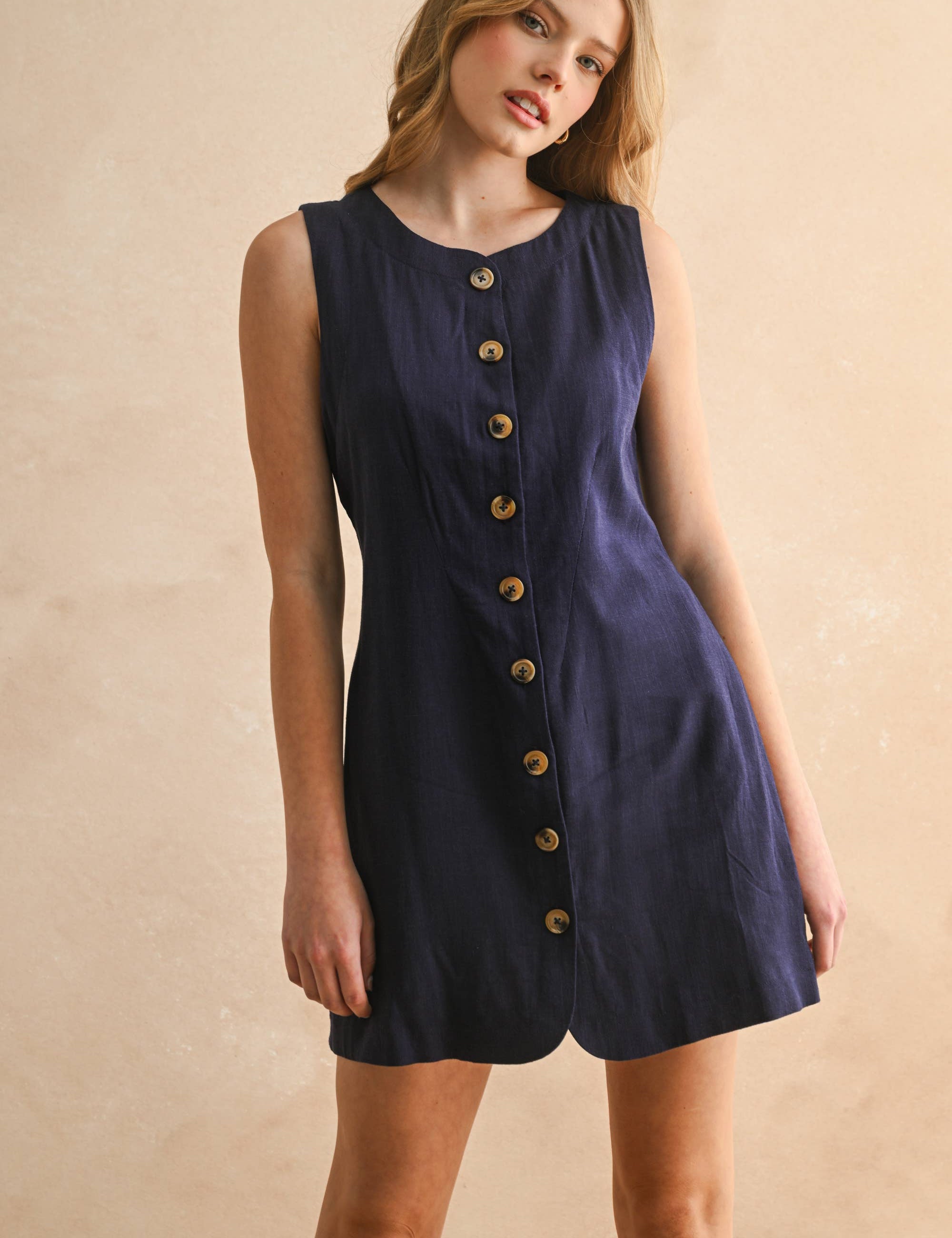 navy linen dress
button front linen dress
sleeveless mini dress
navy summer dress
linen shift dress
navy casual dress
linen dress with pockets
button front mini dress
fully lined linen dress
adjustable back tie dress
classic summer dress
navy sleeveless dress
boutique linen clothing
vacation dress women
timeless summer style
casual linen dress
women's linen mini dress
easy summer outfit
linen dress with buttons
americana summer fashion