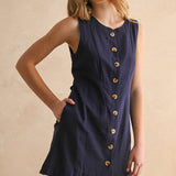 navy linen dress
button front linen dress
sleeveless mini dress
navy summer dress
linen shift dress
navy casual dress
linen dress with pockets
button front mini dress
fully lined linen dress
adjustable back tie dress
classic summer dress
navy sleeveless dress
boutique linen clothing
vacation dress women
timeless summer style
casual linen dress
women's linen mini dress
easy summer outfit
linen dress with buttons
americana summer fashion