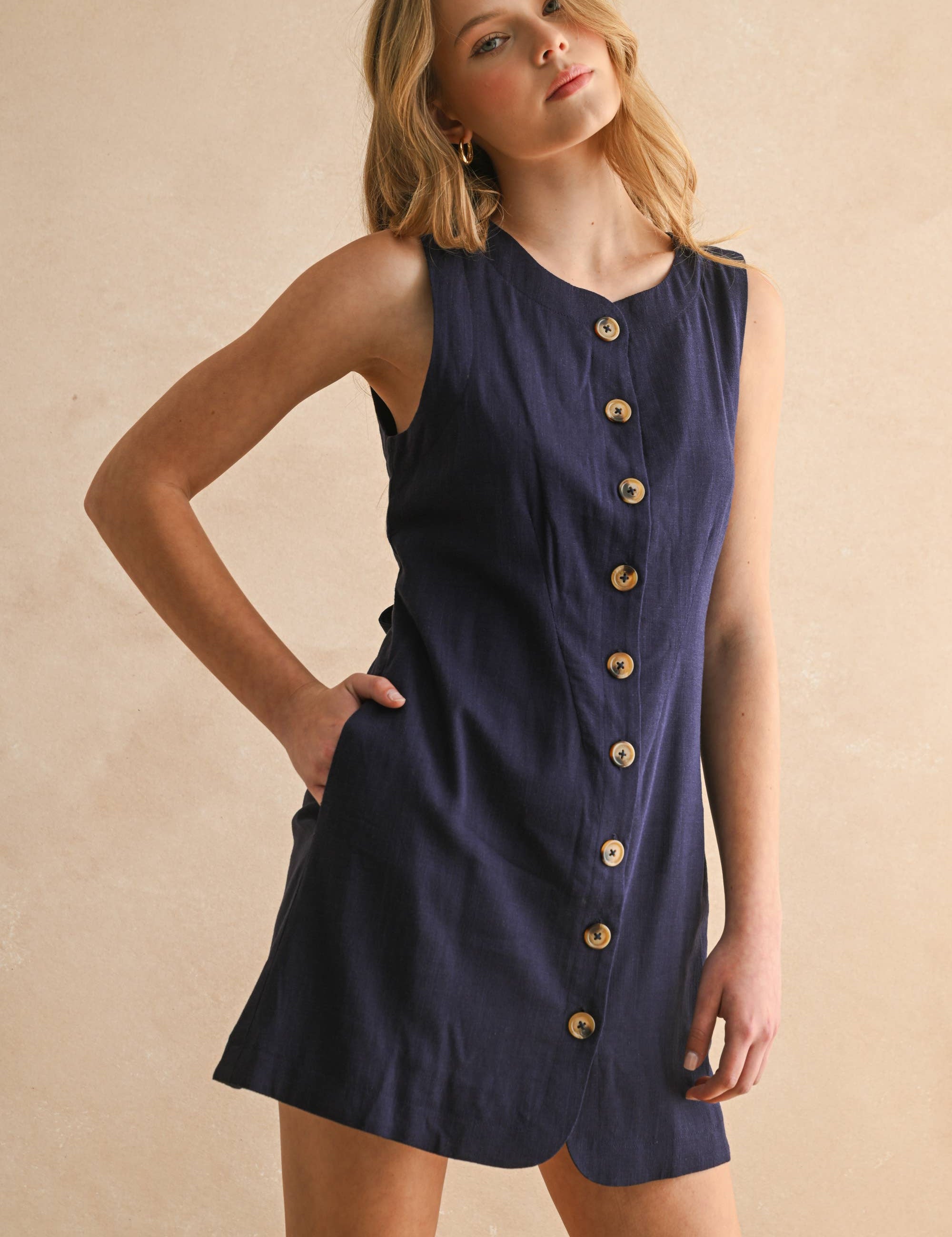navy linen dress
button front linen dress
sleeveless mini dress
navy summer dress
linen shift dress
navy casual dress
linen dress with pockets
button front mini dress
fully lined linen dress
adjustable back tie dress
classic summer dress
navy sleeveless dress
boutique linen clothing
vacation dress women
timeless summer style
casual linen dress
women's linen mini dress
easy summer outfit
linen dress with buttons
americana summer fashion