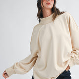 women's oatmeal cotton mock neck sweatshirt with oversized fit, drop shoulders, wide ribbed cuffs, and washed finish