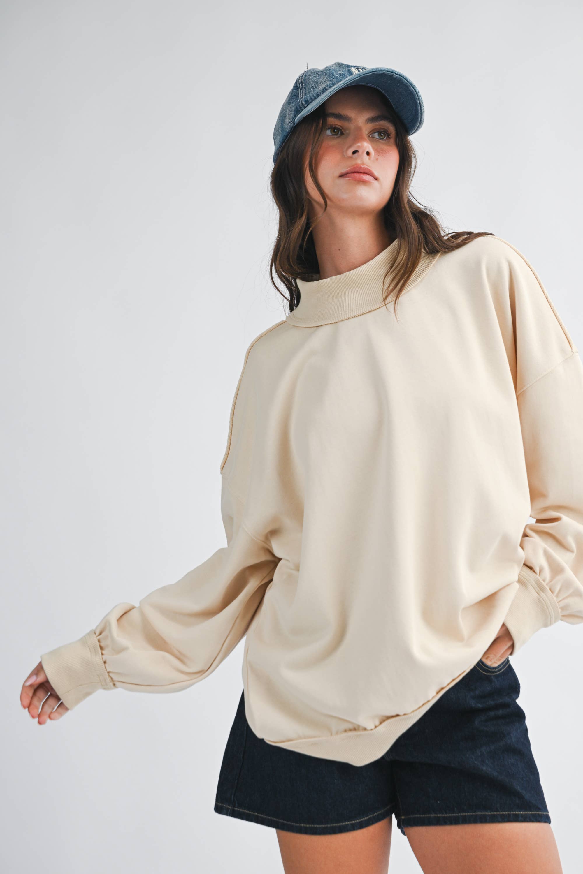 women's oatmeal cotton mock neck sweatshirt with oversized fit, drop shoulders, wide ribbed cuffs, and washed finish