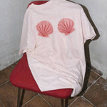 seashell graphic t-shirt
pink shell graphic tee
relaxed fit cotton graphic tee
coastal graphic t-shirt women
outer banks inspired tee
summer casual graphic shirt
light pink cotton t-shirt women
beach inspired graphic tee
casual summer outfit graphic tee
women’s relaxed fit shell shirt
summer spritz collection graphic tee