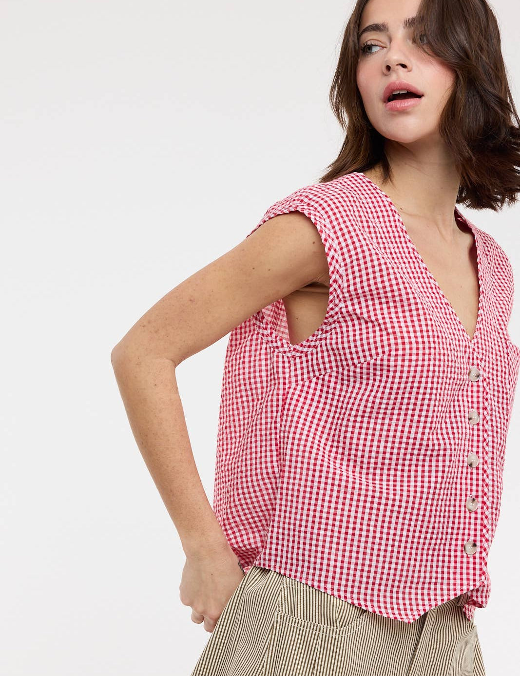 red gingham top
gingham button front blouse
red and white checkered top
sleeveless gingham shirt
boxy fit summer top
picnic outfit top
americana summer clothing
red gingham blouse
casual summer button front top
county fair outfit
lightweight summer blouse
relaxed fit gingham top
classic gingham shirt women
boutique summer clothing
red checkered blouse
summer picnic outfit
casual sleeveless blouse
southern summer style
vintage inspired gingham top
women's button front top