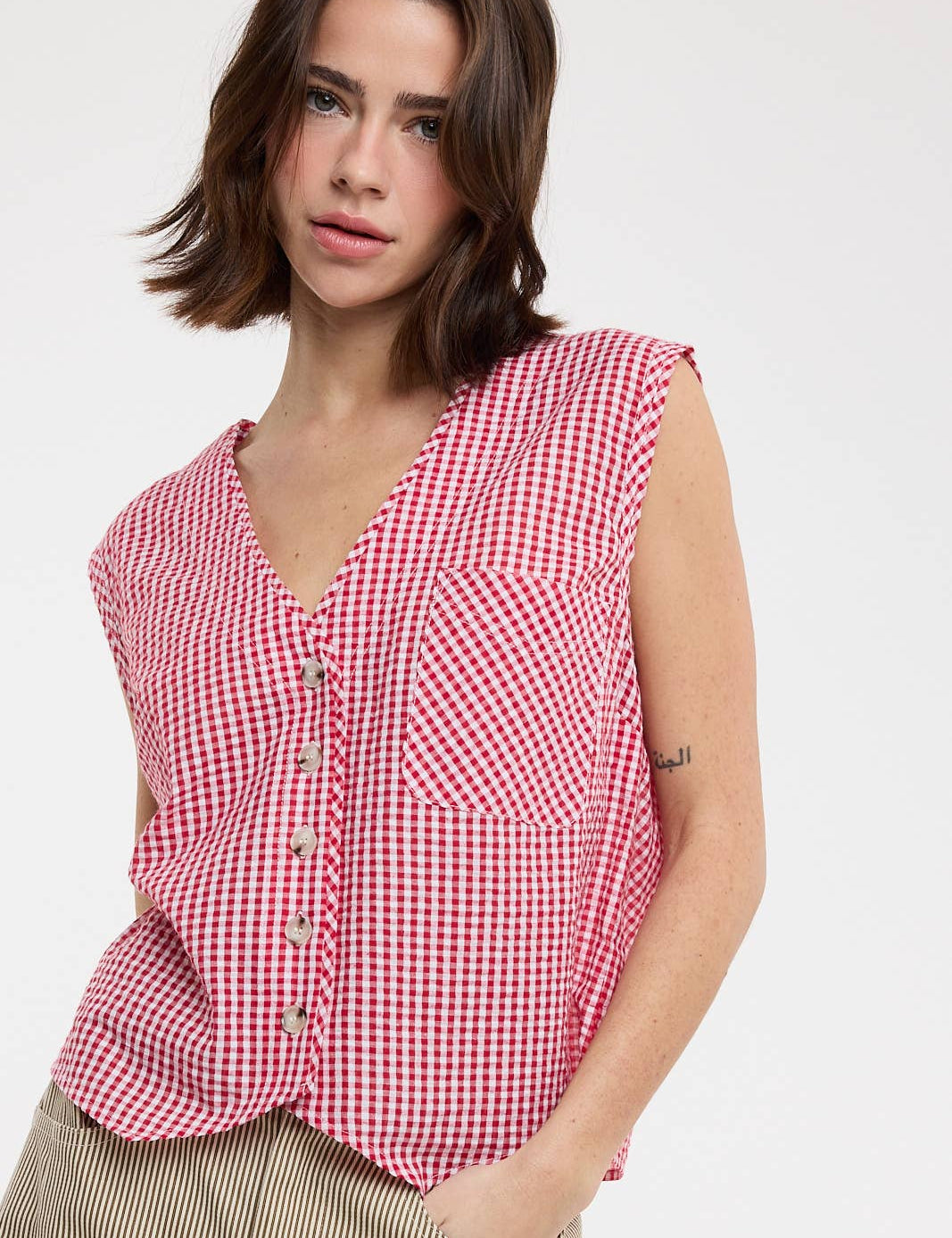 red gingham top
gingham button front blouse
red and white checkered top
sleeveless gingham shirt
boxy fit summer top
picnic outfit top
americana summer clothing
red gingham blouse
casual summer button front top
county fair outfit
lightweight summer blouse
relaxed fit gingham top
classic gingham shirt women
boutique summer clothing
red checkered blouse
summer picnic outfit
casual sleeveless blouse
southern summer style
vintage inspired gingham top
women's button front top