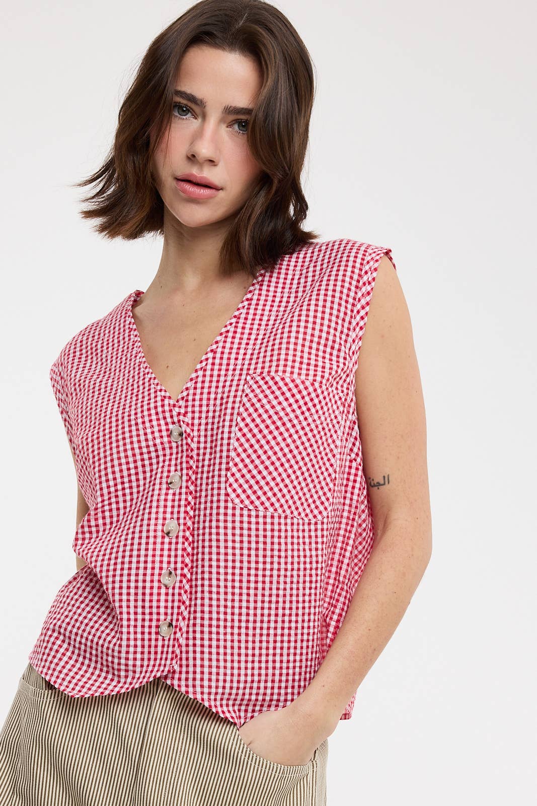 red gingham top
gingham button front blouse
red and white checkered top
sleeveless gingham shirt
boxy fit summer top
picnic outfit top
americana summer clothing
red gingham blouse
casual summer button front top
county fair outfit
lightweight summer blouse
relaxed fit gingham top
classic gingham shirt women
boutique summer clothing
red checkered blouse
summer picnic outfit
casual sleeveless blouse
southern summer style
vintage inspired gingham top
women's button front top