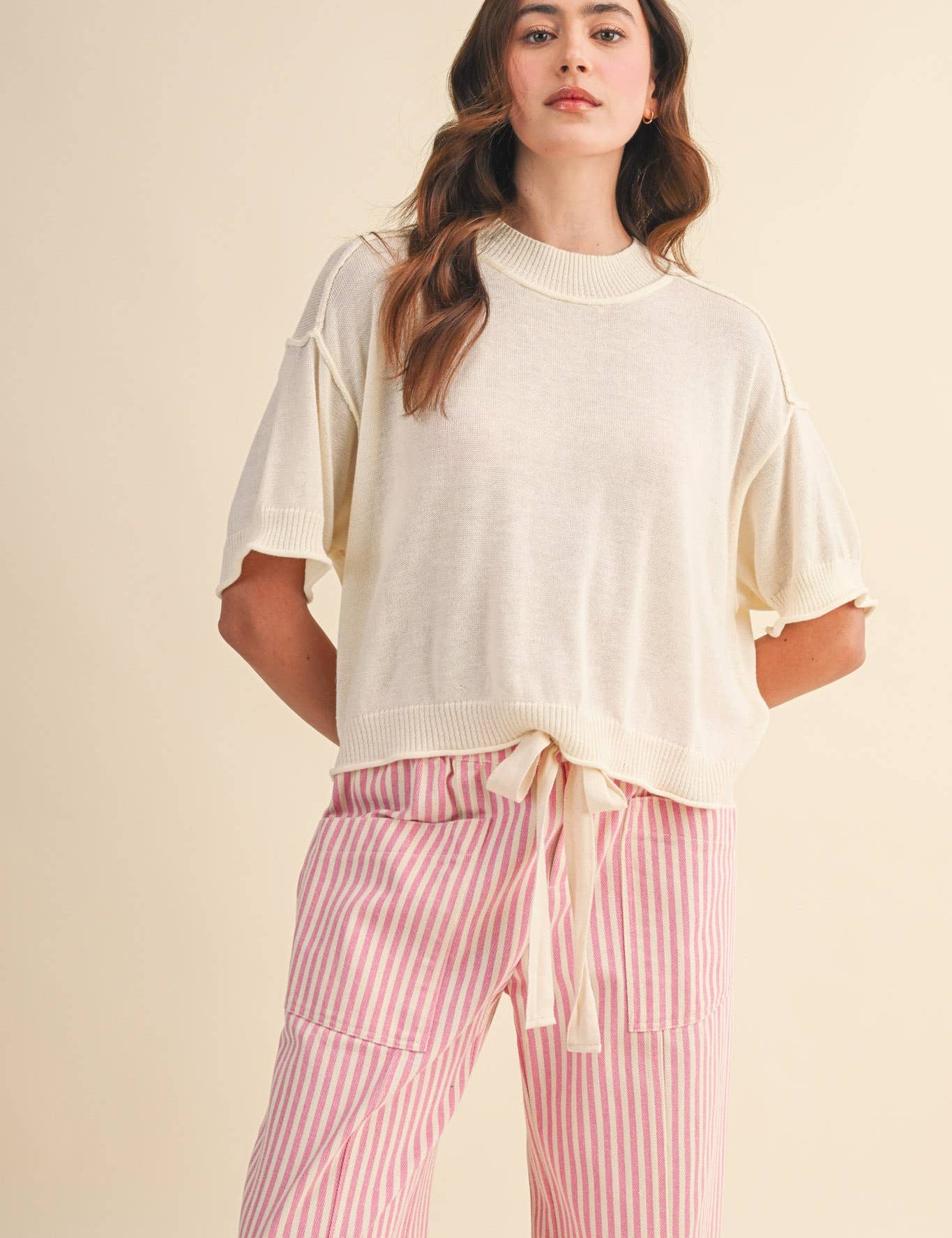 cream sweater tee
lightweight mock neck knit top
short sleeve sweater top
semi cropped knit tee
relaxed cream knit shirt
soft lightweight sweater tee
casual knit top women
ribbed trim sweater tee