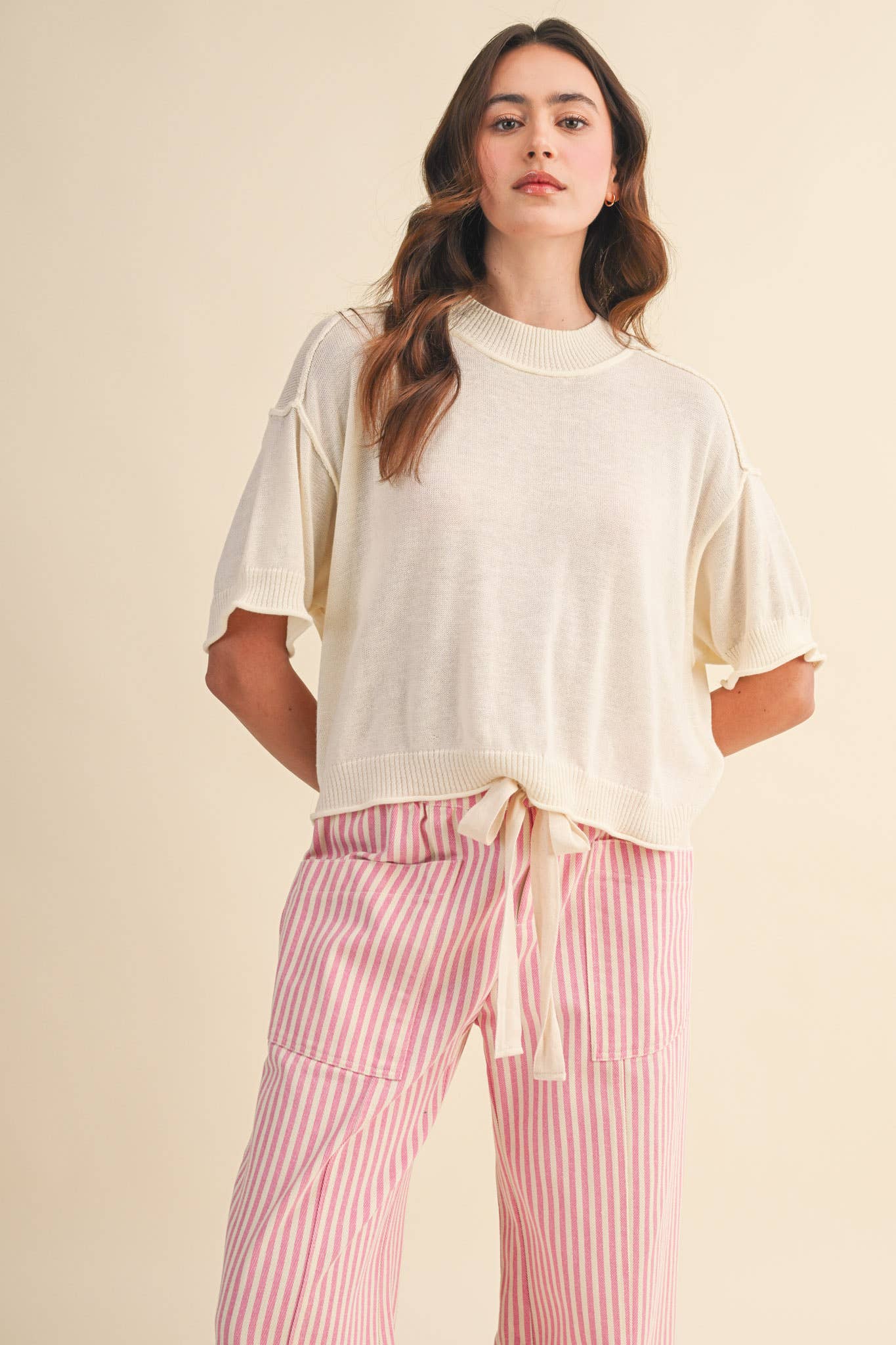 cream sweater tee
lightweight mock neck knit top
short sleeve sweater top
semi cropped knit tee
relaxed cream knit shirt
soft lightweight sweater tee
casual knit top women
ribbed trim sweater tee