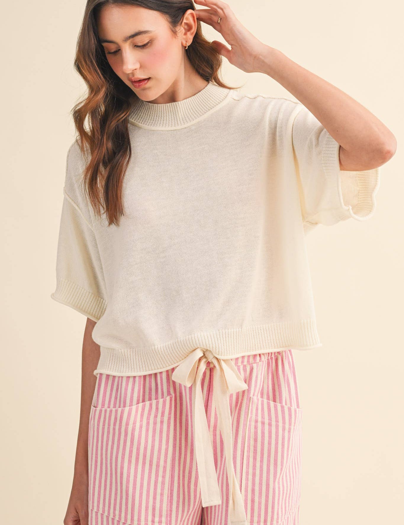 cream sweater tee
lightweight mock neck knit top
short sleeve sweater top
semi cropped knit tee
relaxed cream knit shirt
soft lightweight sweater tee
casual knit top women
ribbed trim sweater tee