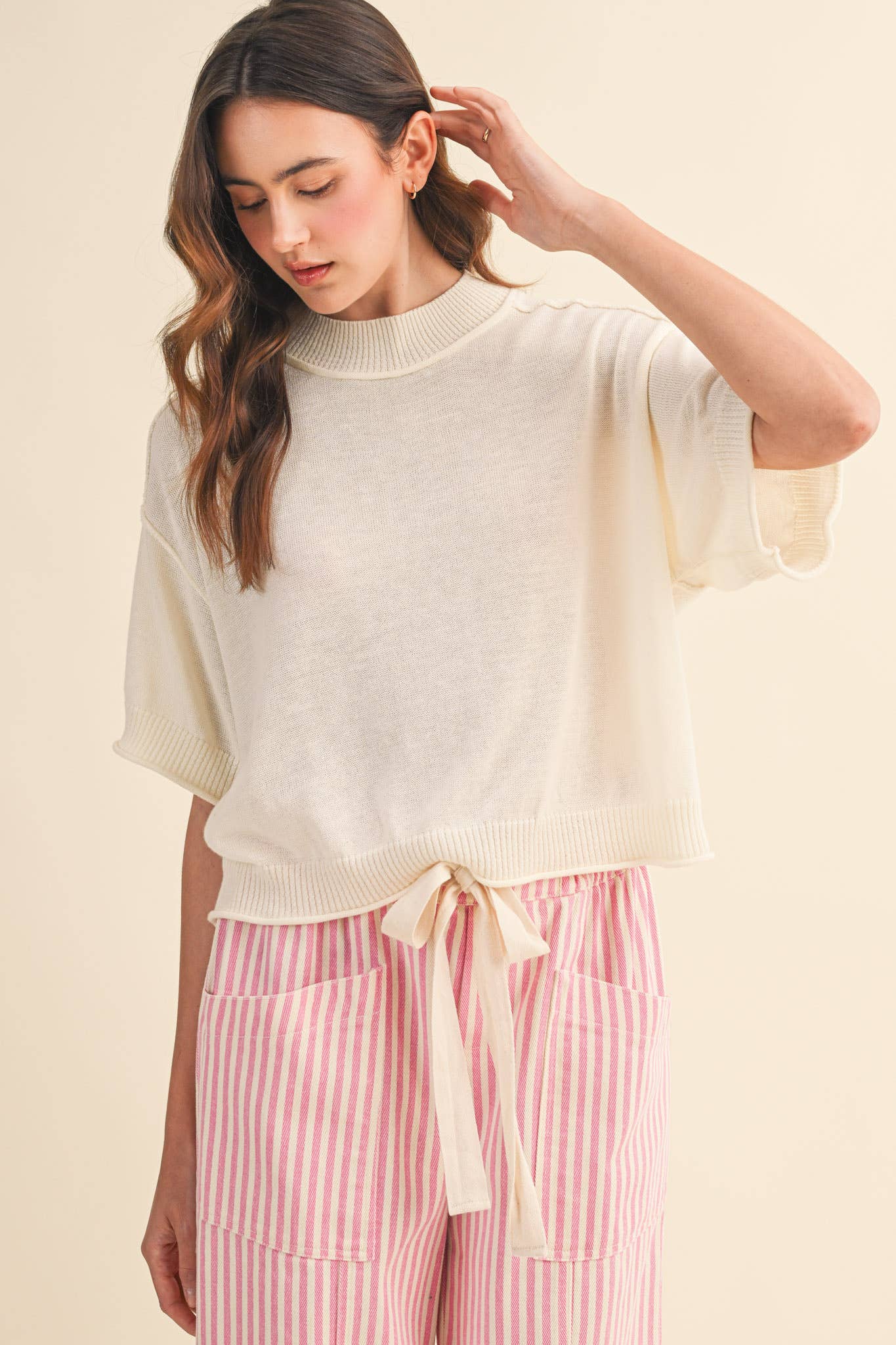 cream sweater tee
lightweight mock neck knit top
short sleeve sweater top
semi cropped knit tee
relaxed cream knit shirt
soft lightweight sweater tee
casual knit top women
ribbed trim sweater tee