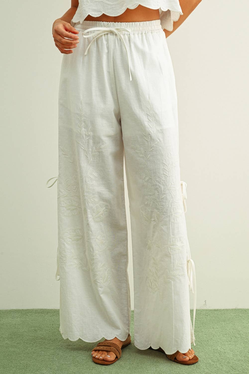 white embroidered cotton linen wide leg pants
relaxed fit embroidered pants with side tie details
lightweight cotton linen pants with wide leg silhouette
white summer pants with embroidery accents
breathable cotton linen trousers for women
matching set embroidered wide leg pants
neutral resort wear pants with side tie detail
elevated white linen blend pants for summer
honeymoon outfit
bachelorette outfit
bridal outfit
