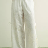 white embroidered cotton linen wide leg pants
relaxed fit embroidered pants with side tie details
lightweight cotton linen pants with wide leg silhouette
white summer pants with embroidery accents
breathable cotton linen trousers for women
matching set embroidered wide leg pants
neutral resort wear pants with side tie detail
elevated white linen blend pants for summer
honeymoon outfit
bachelorette outfit
bridal outfit