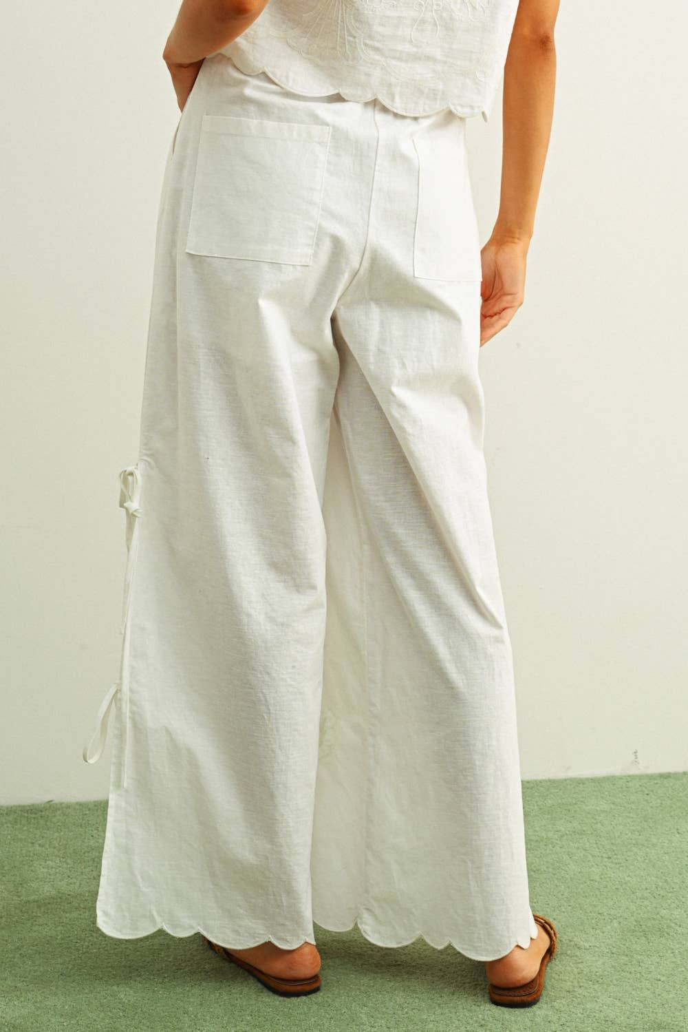 white embroidered cotton linen wide leg pants
relaxed fit embroidered pants with side tie details
lightweight cotton linen pants with wide leg silhouette
white summer pants with embroidery accents
breathable cotton linen trousers for women
matching set embroidered wide leg pants
neutral resort wear pants with side tie detail
elevated white linen blend pants for summer
honeymoon outfit
bachelorette outfit
bridal outfit