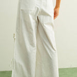 white embroidered cotton linen wide leg pants
relaxed fit embroidered pants with side tie details
lightweight cotton linen pants with wide leg silhouette
white summer pants with embroidery accents
breathable cotton linen trousers for women
matching set embroidered wide leg pants
neutral resort wear pants with side tie detail
elevated white linen blend pants for summer
honeymoon outfit
bachelorette outfit
bridal outfit