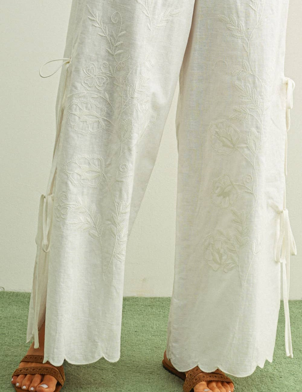 white embroidered cotton linen wide leg pants
relaxed fit embroidered pants with side tie details
lightweight cotton linen pants with wide leg silhouette
white summer pants with embroidery accents
breathable cotton linen trousers for women
matching set embroidered wide leg pants
neutral resort wear pants with side tie detail
elevated white linen blend pants for summer
honeymoon outfit
bachelorette outfit
bridal outfit