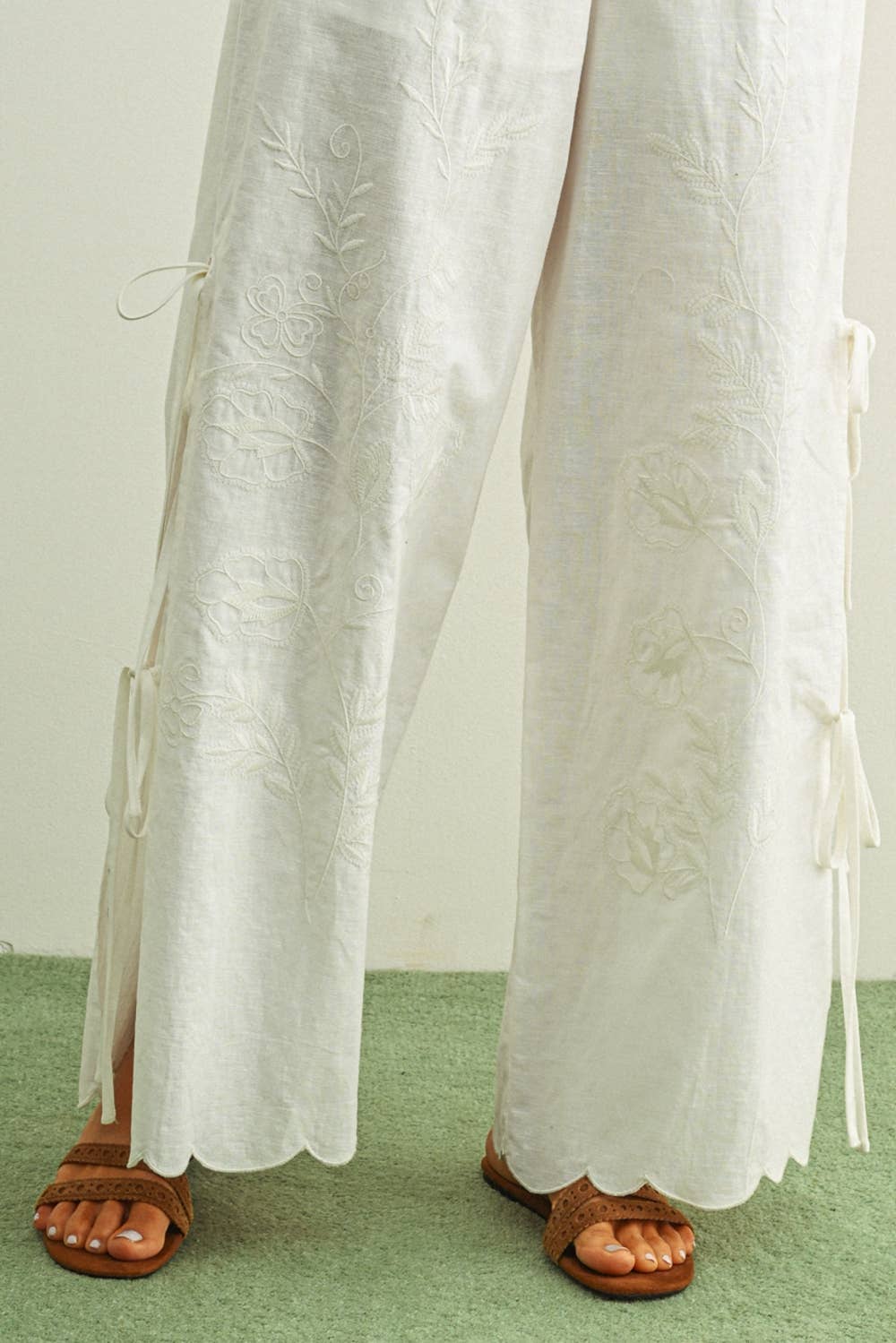 white embroidered cotton linen wide leg pants
relaxed fit embroidered pants with side tie details
lightweight cotton linen pants with wide leg silhouette
white summer pants with embroidery accents
breathable cotton linen trousers for women
matching set embroidered wide leg pants
neutral resort wear pants with side tie detail
elevated white linen blend pants for summer
honeymoon outfit
bachelorette outfit
bridal outfit