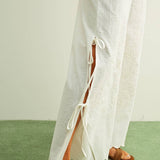 white embroidered cotton linen wide leg pants
relaxed fit embroidered pants with side tie details
lightweight cotton linen pants with wide leg silhouette
white summer pants with embroidery accents
breathable cotton linen trousers for women
matching set embroidered wide leg pants
neutral resort wear pants with side tie detail
elevated white linen blend pants for summer
honeymoon outfit
bachelorette outfit
bridal outfit