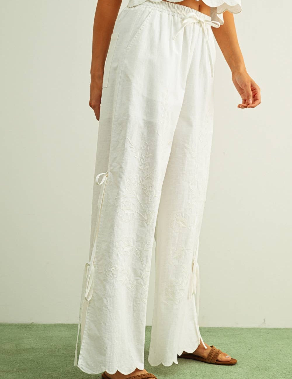 white embroidered cotton linen wide leg pants
relaxed fit embroidered pants with side tie details
lightweight cotton linen pants with wide leg silhouette
white summer pants with embroidery accents
breathable cotton linen trousers for women
matching set embroidered wide leg pants
neutral resort wear pants with side tie detail
elevated white linen blend pants for summer
honeymoon outfit
bachelorette outfit
bridal outfit