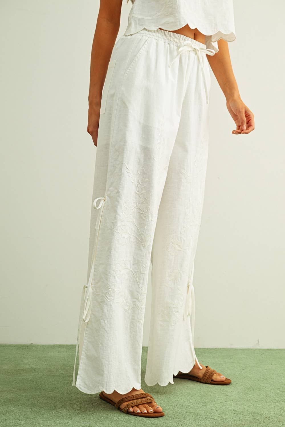 white embroidered cotton linen wide leg pants
relaxed fit embroidered pants with side tie details
lightweight cotton linen pants with wide leg silhouette
white summer pants with embroidery accents
breathable cotton linen trousers for women
matching set embroidered wide leg pants
neutral resort wear pants with side tie detail
elevated white linen blend pants for summer
honeymoon outfit
bachelorette outfit
bridal outfit