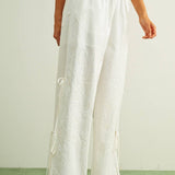 white embroidered cotton linen wide leg pants
relaxed fit embroidered pants with side tie details
lightweight cotton linen pants with wide leg silhouette
white summer pants with embroidery accents
breathable cotton linen trousers for women
matching set embroidered wide leg pants
neutral resort wear pants with side tie detail
elevated white linen blend pants for summer
honeymoon outfit
bachelorette outfit
bridal outfit
