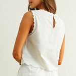 embroidered cotton linen sleeveless top with side ties
white embroidered tank top with relaxed boxy fit
cotton linen sleeveless blouse with tie side detail
lightweight embroidered summer top in white
relaxed fit cotton linen tank with embroidery
white sleeveless top paired with matching linen pants
breathable cotton linen blouse for summer
embroidered neutral top with hip length silhouette
bridal outfit
bachelorette outfit
bridal shower outfit