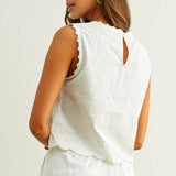 embroidered cotton linen sleeveless top with side ties
white embroidered tank top with relaxed boxy fit
cotton linen sleeveless blouse with tie side detail
lightweight embroidered summer top in white
relaxed fit cotton linen tank with embroidery
white sleeveless top paired with matching linen pants
breathable cotton linen blouse for summer
embroidered neutral top with hip length silhouette
bridal outfit
bachelorette outfit
bridal shower outfit
