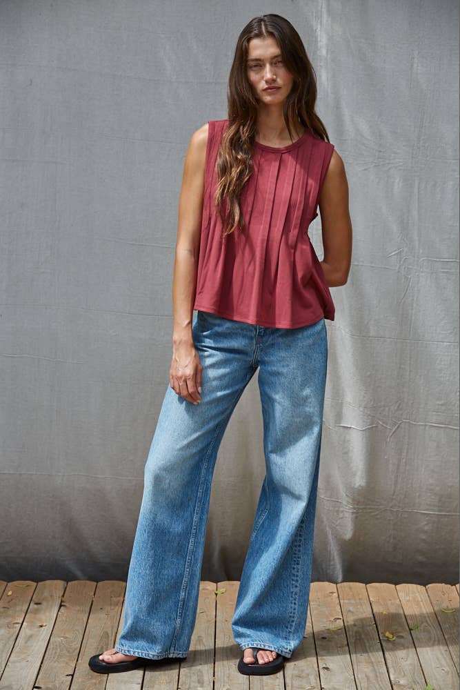 rust red sleeveless rayon blend tank top with front pleats, crew neckline and relaxed gathered silhouette
