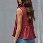 rust red sleeveless rayon blend tank top with front pleats, crew neckline and relaxed gathered silhouette