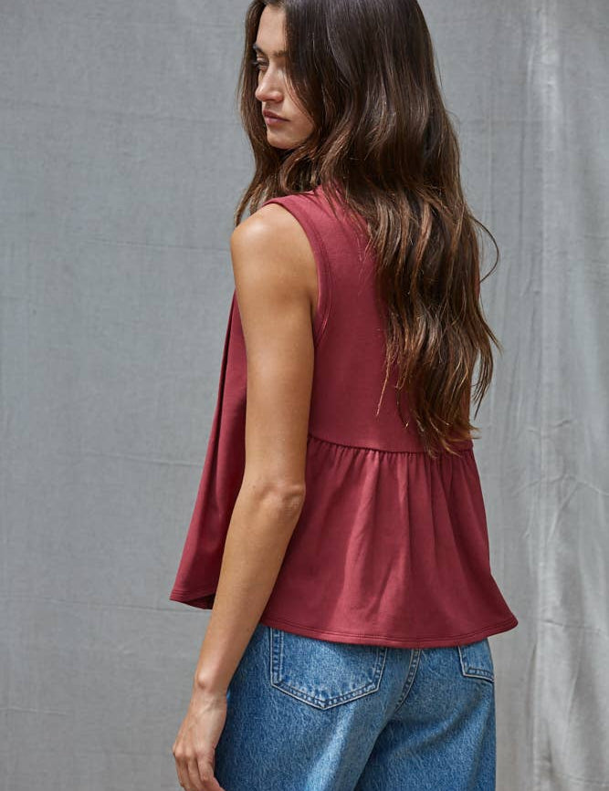 rust red sleeveless rayon blend tank top with front pleats, crew neckline and relaxed gathered silhouette