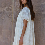 white oversized mini dress
flowy vacation dress women
off shoulder summer mini dress
lace detail oversized dress
beach coverup style mini dress
resort wear white dress women
airy summer vacation dress
relaxed fit white mini dress
italian summer inspired dress
summer spritz collection dress
bachelorette party dress
bridal casual dress
little white dress