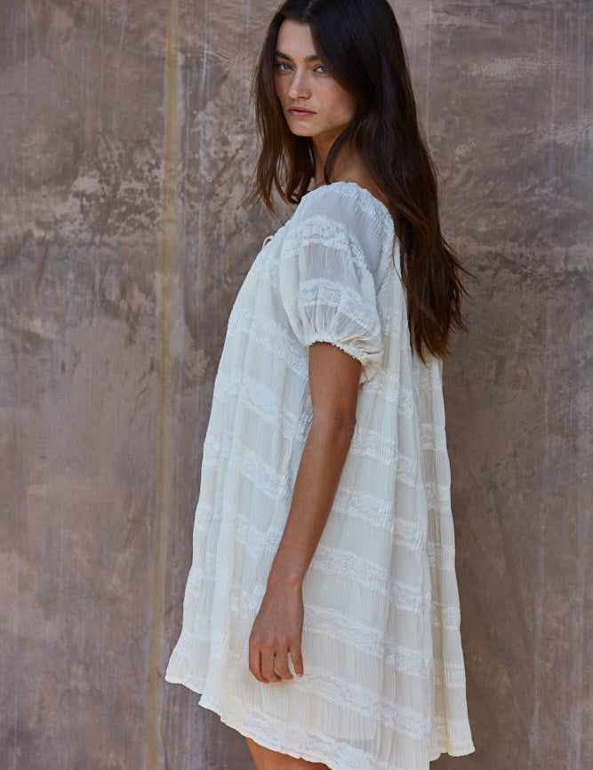 white oversized mini dress
flowy vacation dress women
off shoulder summer mini dress
lace detail oversized dress
beach coverup style mini dress
resort wear white dress women
airy summer vacation dress
relaxed fit white mini dress
italian summer inspired dress
summer spritz collection dress
bachelorette party dress
bridal casual dress
little white dress
