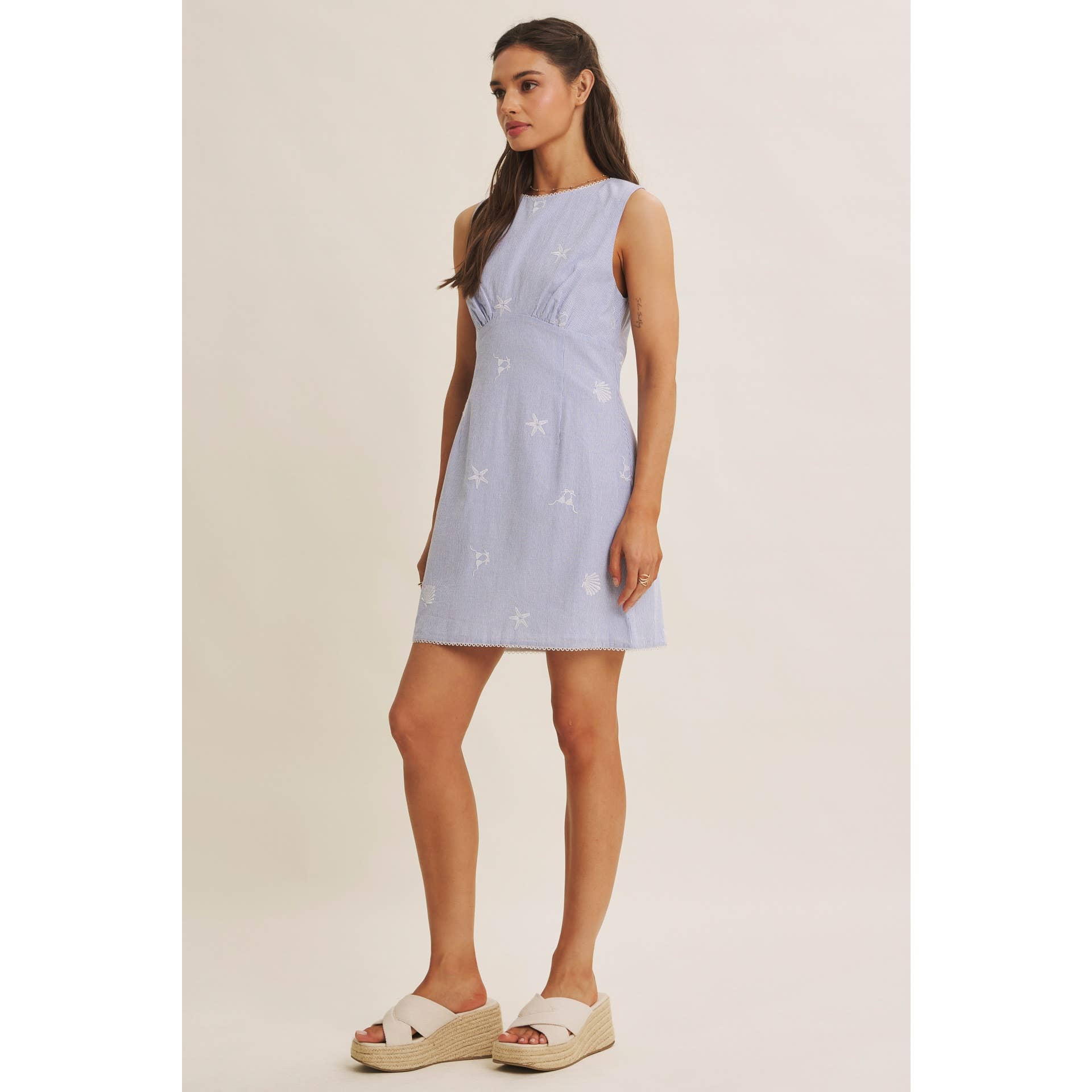 blue striped embroidered mini dress
coastal embroidered summer dress
starfish embroidered mini dress
beach vacation dress women
sleeveless cotton blend mini dress
resort wear boutique dress
blue summer brunch dress
coastal chic mini dress
italian summer outfit women
west of may spritz collection