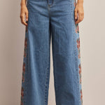 floral embroidered jeans, embroidered wide leg jeans, women’s wide leg denim, high rise wide leg jeans, floral denim, western embroidered jeans, boho wide leg jeans, medium wash jeans, statement denim, women’s fall jeans, boutique denim, embroidered denim pants