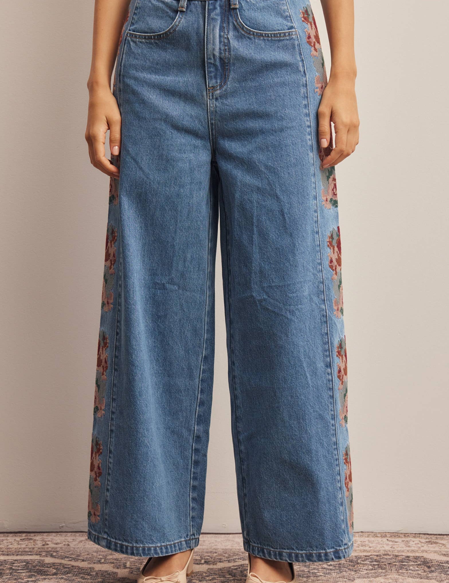 floral embroidered jeans, embroidered wide leg jeans, women’s wide leg denim, high rise wide leg jeans, floral denim, western embroidered jeans, boho wide leg jeans, medium wash jeans, statement denim, women’s fall jeans, boutique denim, embroidered denim pants