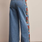 floral embroidered jeans, embroidered wide leg jeans, women’s wide leg denim, high rise wide leg jeans, floral denim, western embroidered jeans, boho wide leg jeans, medium wash jeans, statement denim, women’s fall jeans, boutique denim, embroidered denim pants