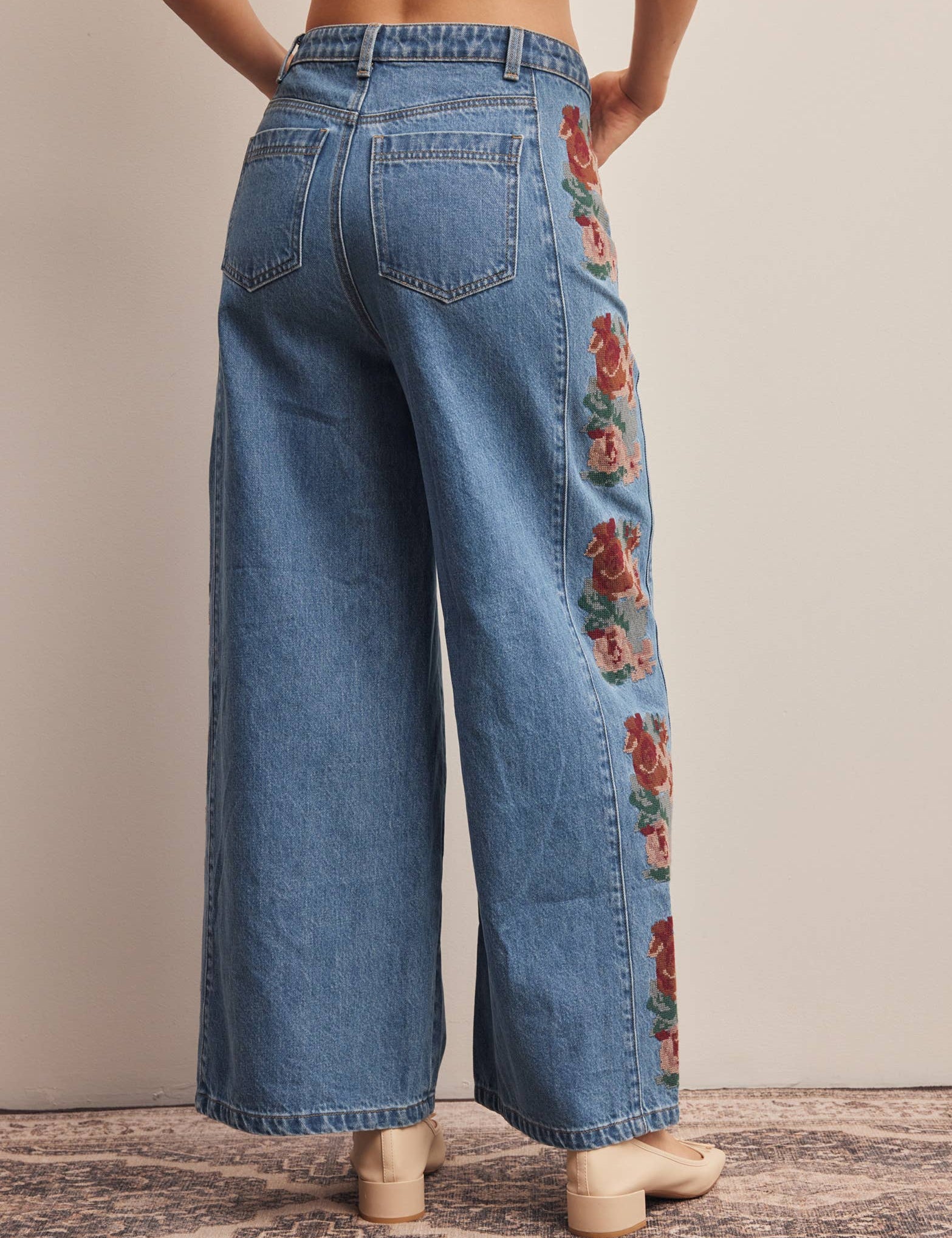 floral embroidered jeans, embroidered wide leg jeans, women’s wide leg denim, high rise wide leg jeans, floral denim, western embroidered jeans, boho wide leg jeans, medium wash jeans, statement denim, women’s fall jeans, boutique denim, embroidered denim pants