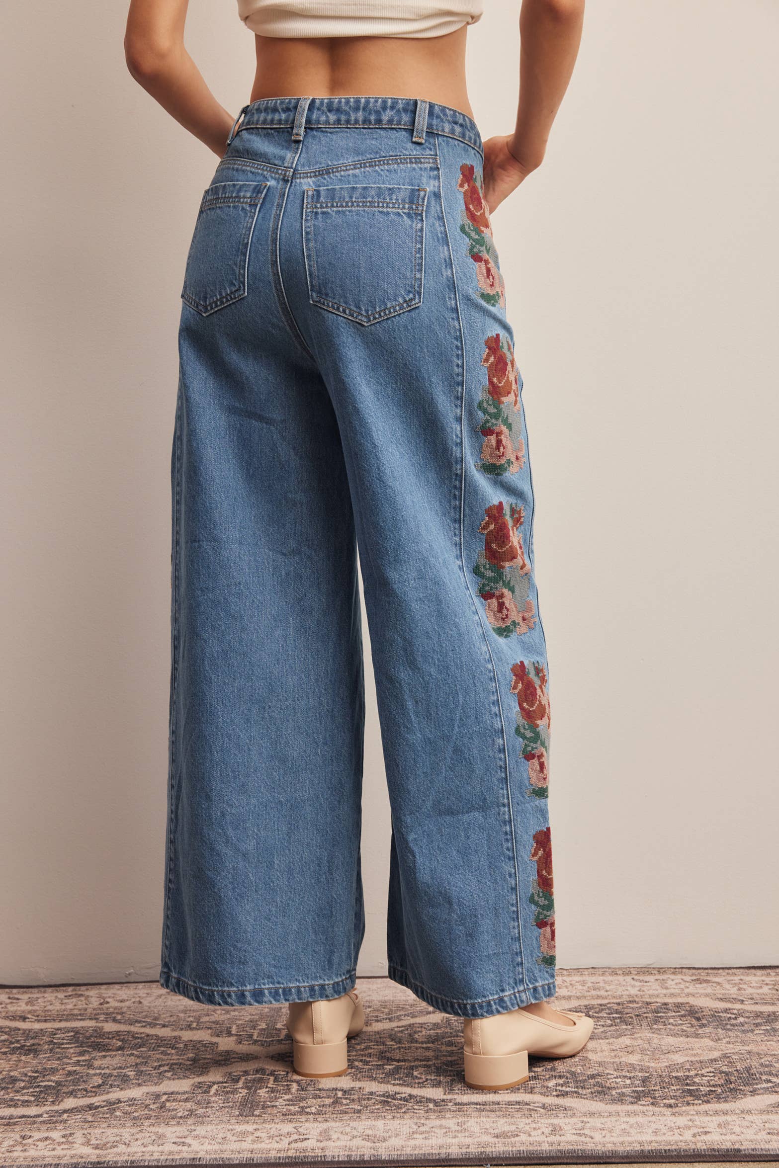 floral embroidered jeans, embroidered wide leg jeans, women’s wide leg denim, high rise wide leg jeans, floral denim, western embroidered jeans, boho wide leg jeans, medium wash jeans, statement denim, women’s fall jeans, boutique denim, embroidered denim pants